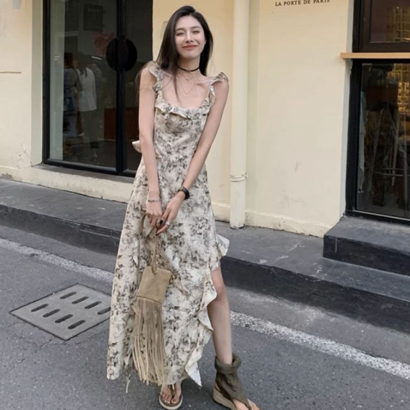 Gentle vacation style French high-end sense irregular floral suspender dress for women in summer temperament slim seaside long skirt