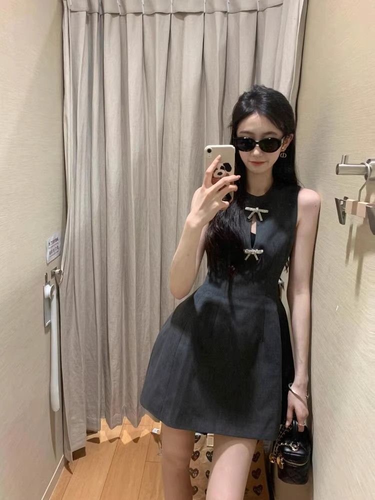蝴蝶結鏤空無袖連衣裙子女收腰顯瘦氣質設計高級感小眾性感短裙夏