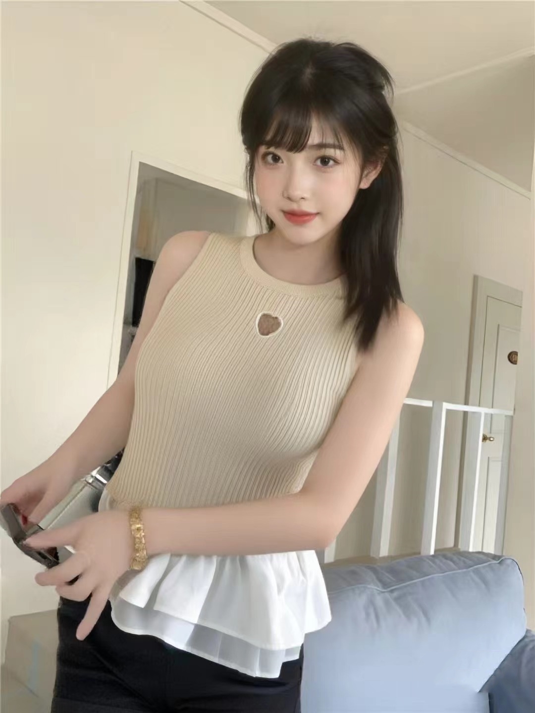純欲風愛心鏤空撞色拼接無袖背心女夏季設計感小眾荷葉邊裙擺上衣