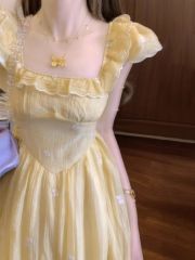 French yellow small flying sleeve floral dress for women in summer 2025 new waist-hugging temperament princess vacation long skirt