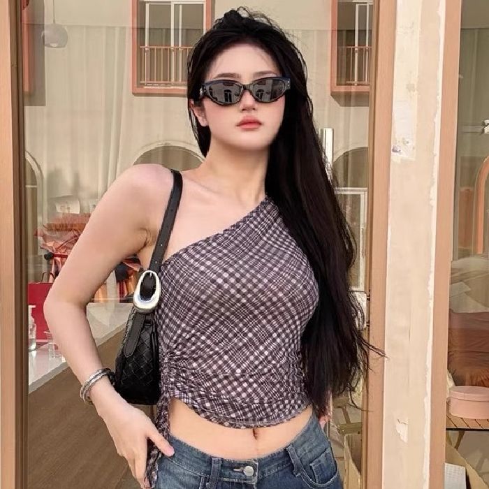 A hot girl with black plaid ribbon halter neck vest with hottie in her inner body, a slim fit and slim top