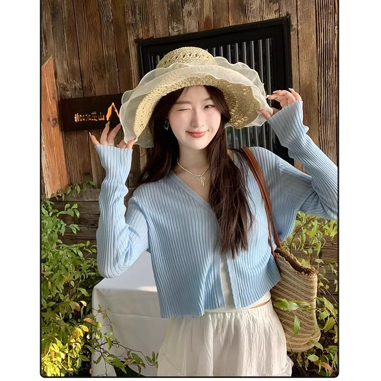 Green sunscreen cardigan for women in summer thin long-sleeved blouse 2025 new style with suspender skirt and knitted top