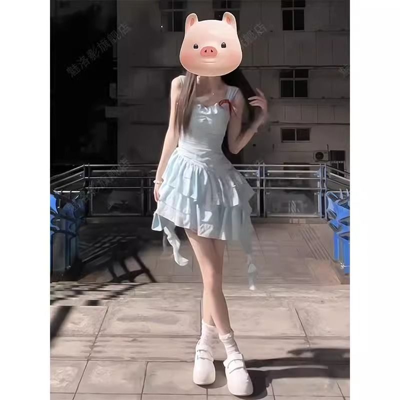 Seaside vacation blue suspender dress for women in summer 2025 new irregular waist-hugging princess cake puffy skirt