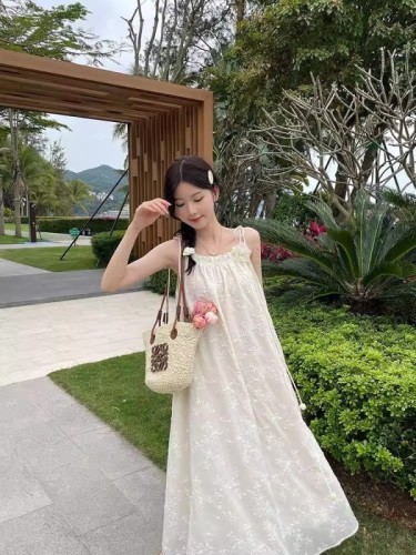 Sweet little fresh chiffon embroidered jacquard temperament suspender dress for women in summer new holiday style tassel skirt