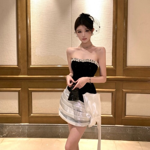 Real-shot, luxe yet understated waist-defined, contrasting-color, finely shimmering velvet tube dress—sheath-style with tie-up details for a sleek, figure-flattering fit.