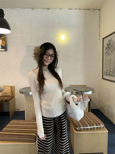 Real-shot, authentic minimalist one-piece knitwear: women's base-layer sweater—seamless, figure-flattering, and perfectly fitted for a slimming look.