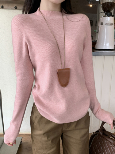 Real-shot, authentic minimalist one-piece knitwear: women's base-layer sweater—seamless, figure-flattering, and perfectly fitted for a slimming look.