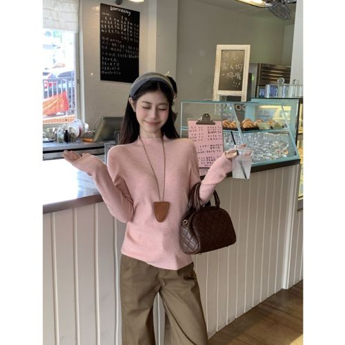 Real-shot, authentic minimalist one-piece knitwear: women's base-layer sweater—seamless, figure-flattering, and perfectly fitted for a slimming look.