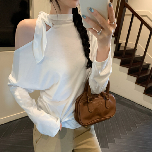 The photo-realistic image features a stunning white sleeveless off-shoulder top with a neck tie, creating a chic look. The crop top has long sleeves and accentuates the waist beautifully.