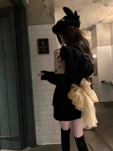 Korean-style black bow-knot backless long-sleeved sweater for women—autumn/winter thickened, laid-back style, spicy girl-style knitted off-shoulder top.