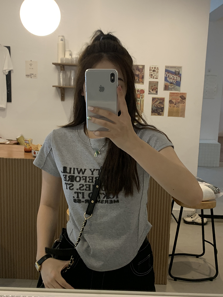 Irregular curved short-sleeved women's spring and summer new hot girl slim bottoming shirt design letter short all-match top