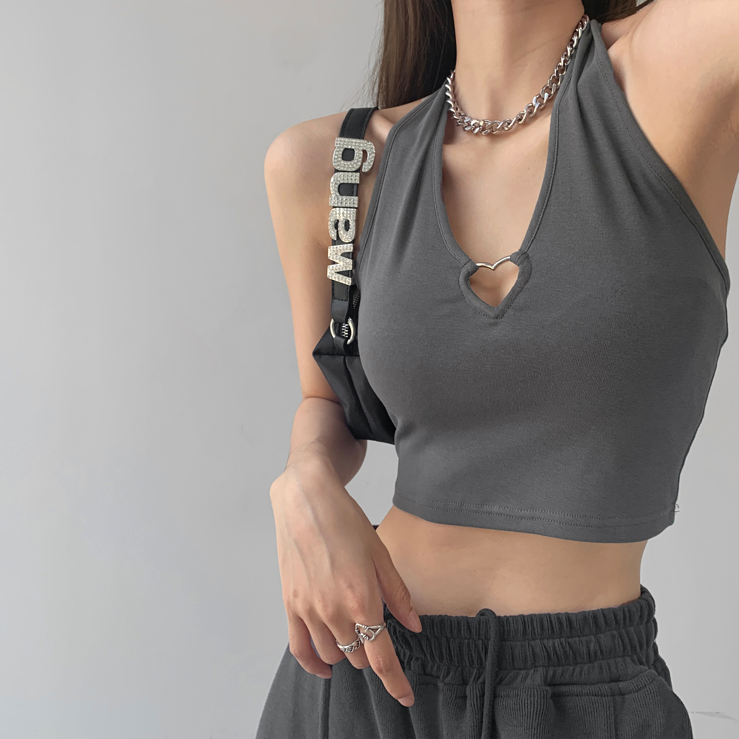 New Spice Girl Metal love hollow out hanging neck suspender design, wearing sleeveless top and exposed navel short vest