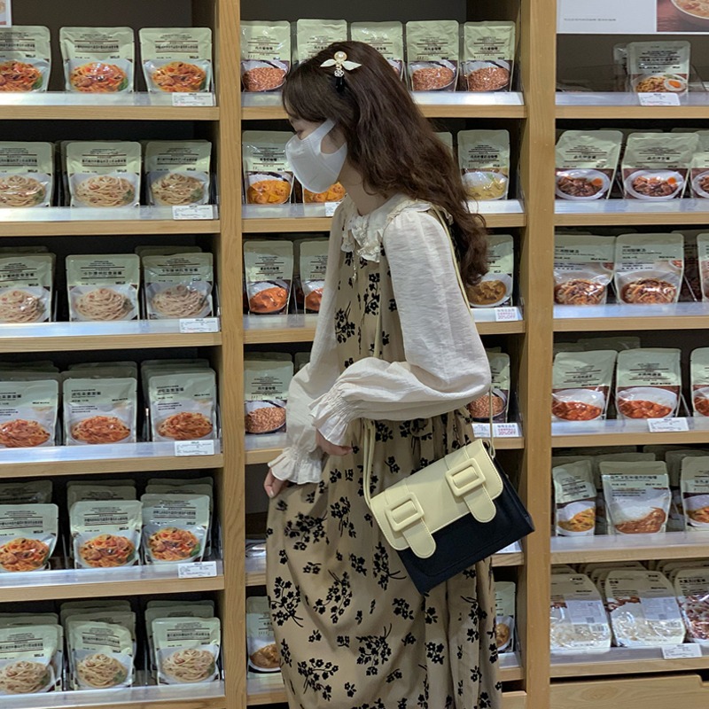 Fake two piece long sleeved dress women's dress spring and autumn 2022 new college style design baby collar long skirt trend