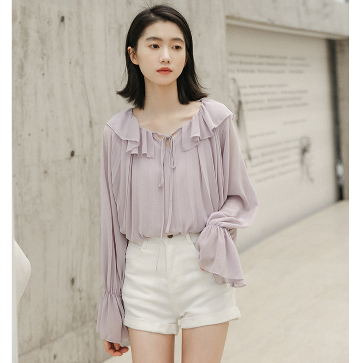 It's an immortal coat with a sense of minority design. Lotus leaf Collar Chiffon shirt. Women's bow loose western style shirt