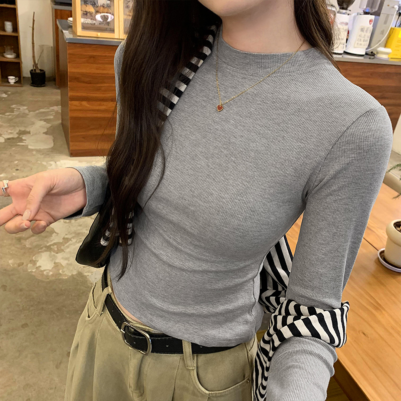 Photographed image of a women's early autumn new high-end round neck belted base layer T-shirt with a straight shoulder design