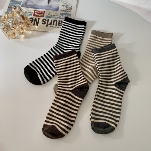 Real shot real price striped socks women's autumn and winter in the tube socks outside the tide net red style coffee Japanese stockings pile socks
