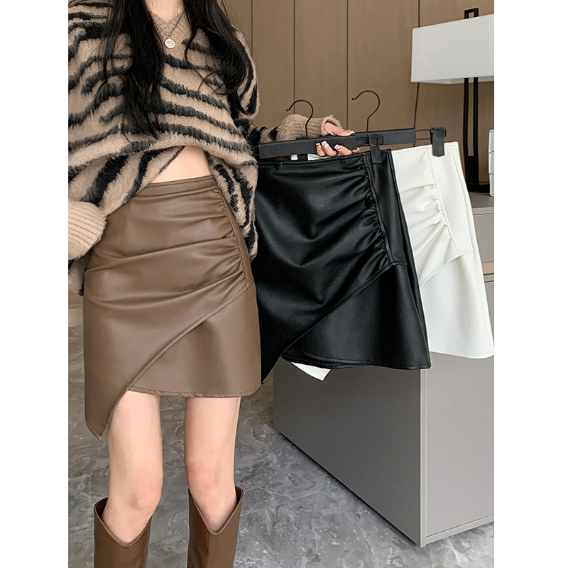Real shot 2023 spring irregular design leather skirt skirt female pu bag hip high waist short skirt