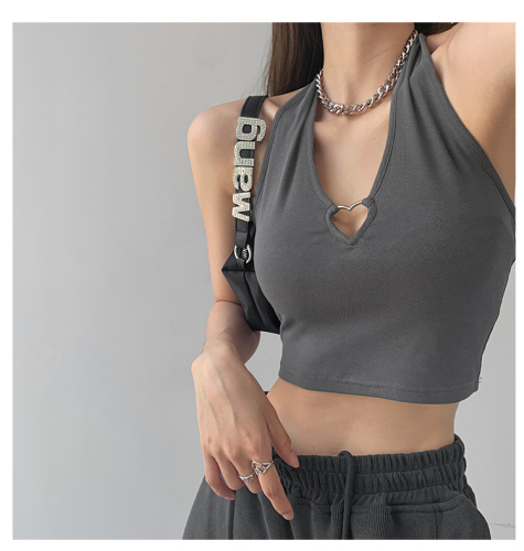 Cool SA Spice Girl Metal love hollow out hanging neck suspender design, wearing sleeveless top and exposed navel short vest