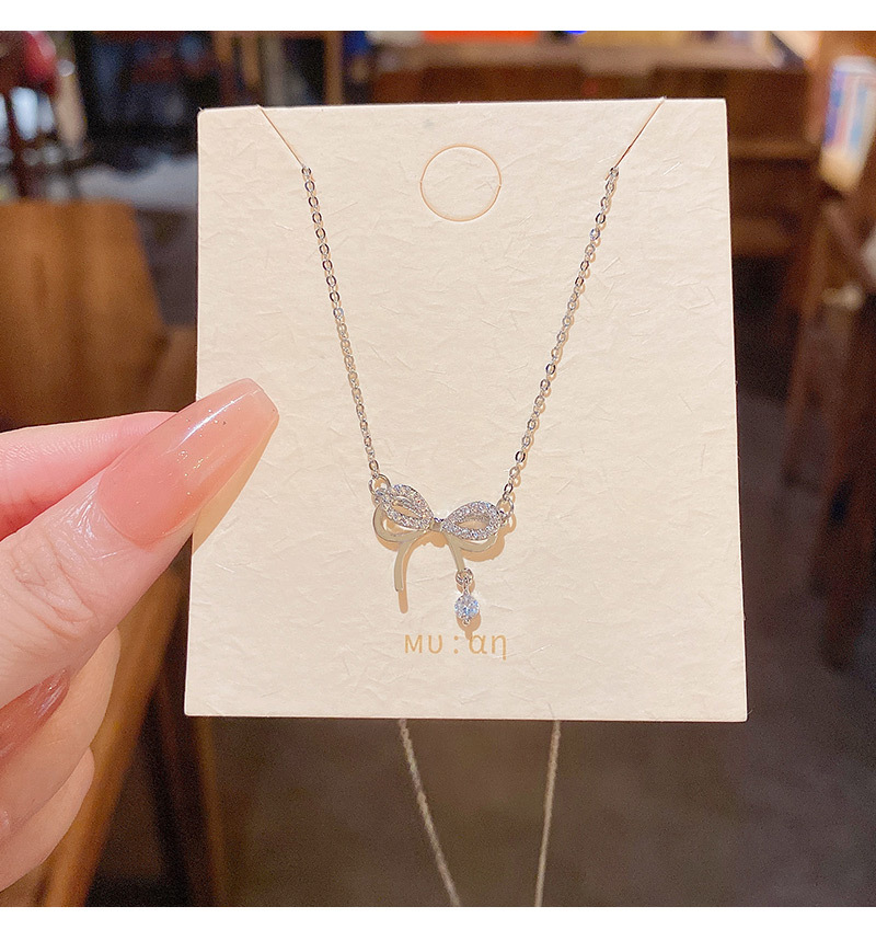 South Korea's new double bow titanium steel necklace female ins tide light luxury niche zircon exquisite clavicle chain wholesale