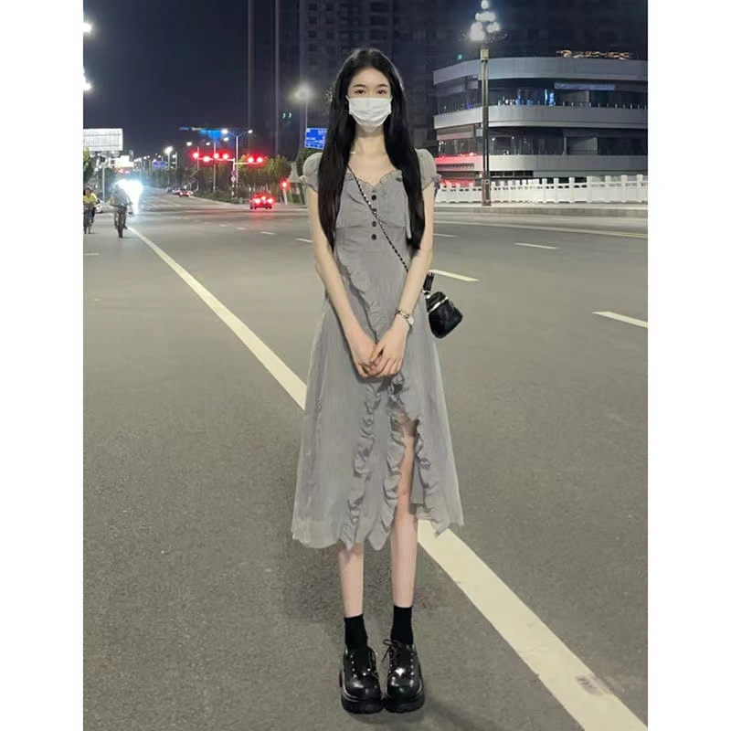 College style temperament girl dress 2023 summer new design sense wood ear side slit mid-length skirt