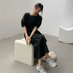 Black dress with square neck and bubble sleeves