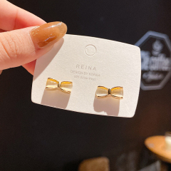 Real shot S925 silver needle Bow Earrings female personality versatile temperament cat's eye Stud Earrings