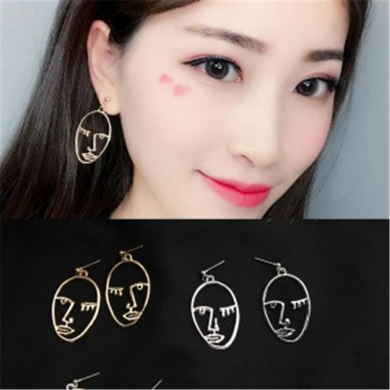 Korean version of the new personality face hollow Earrings facial eyes elliptical earpin Earrings