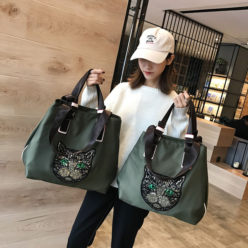 Shoulder bag women's new high capacity handbag fashion men's luggage bag sequined cat's head travel bag