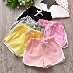 Summer new Korean children's shorts pure color boys and girls sports shorts children's cotton beach pants