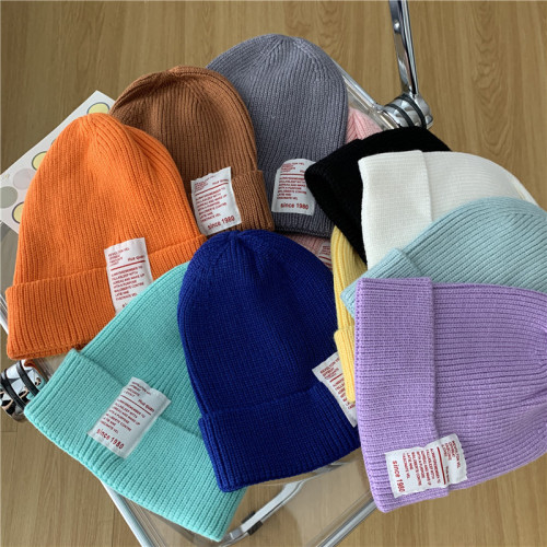 Real shooting real price Korean version of the same candy color label knitted wool warm hat for men and women