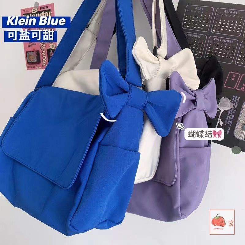 Korean ins bow knot solid color Single Shoulder Messenger Bag female Japanese simple and versatile student canvas postman bag