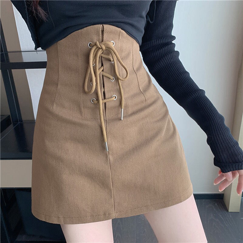 Half length skirt children's spring / summer 2022 hot girl design sense of minority bandage high waist thin net red A-shaped Hip Wrap short skirt