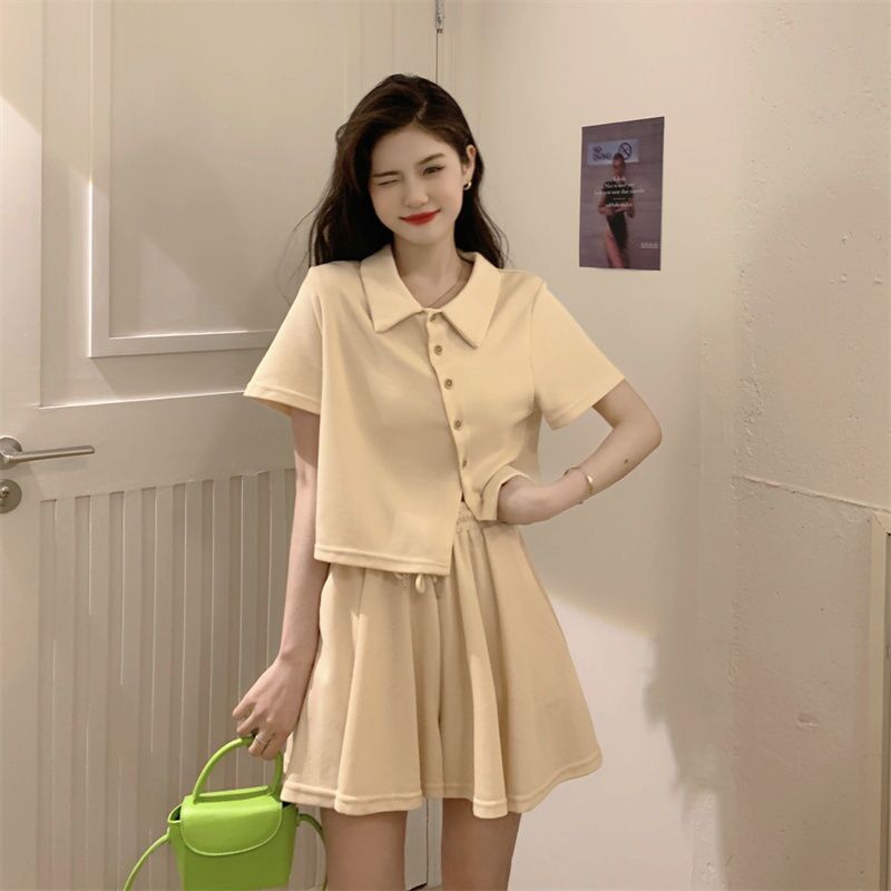 Single / suit summer new irregular polo collar Short Sleeve Top + meat covered wide leg pants skirt leisure sports two piece set