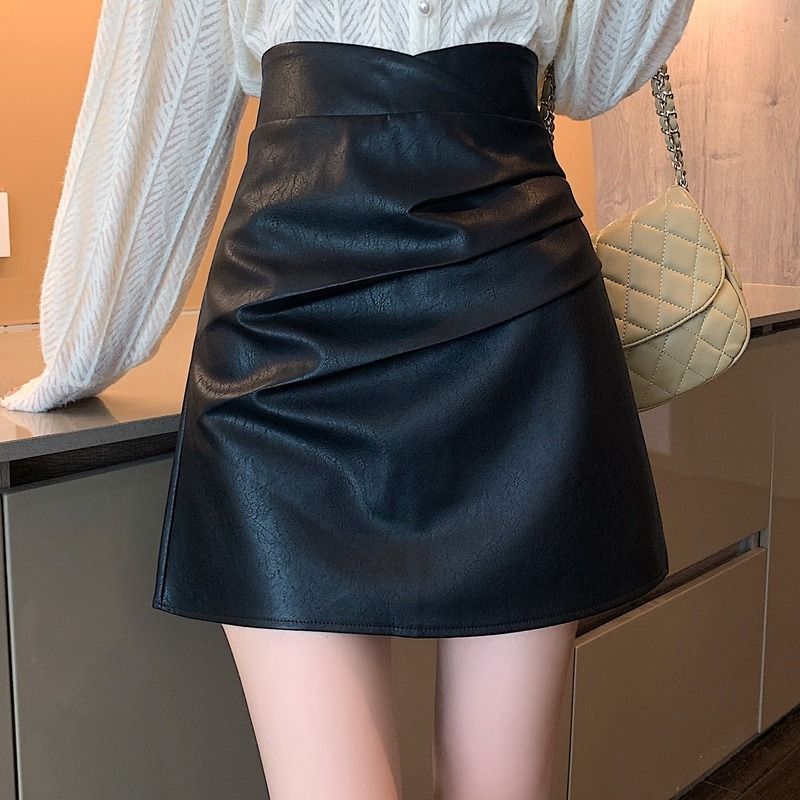 Black leather skirt skirt women's 2022 autumn and winter new high-waist temperament pleated a-line skirt slimming hip short skirt