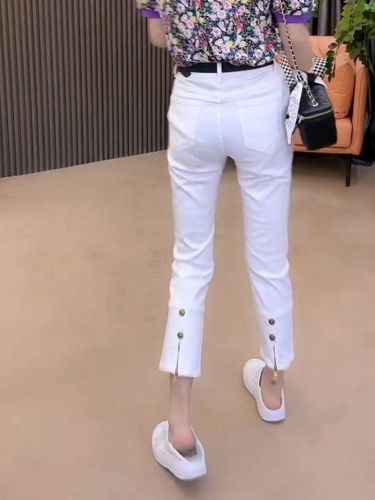European station 2022 autumn new trousers gold buckle zipper slit thin jeans women's stretch thin eight-point cigarette pants