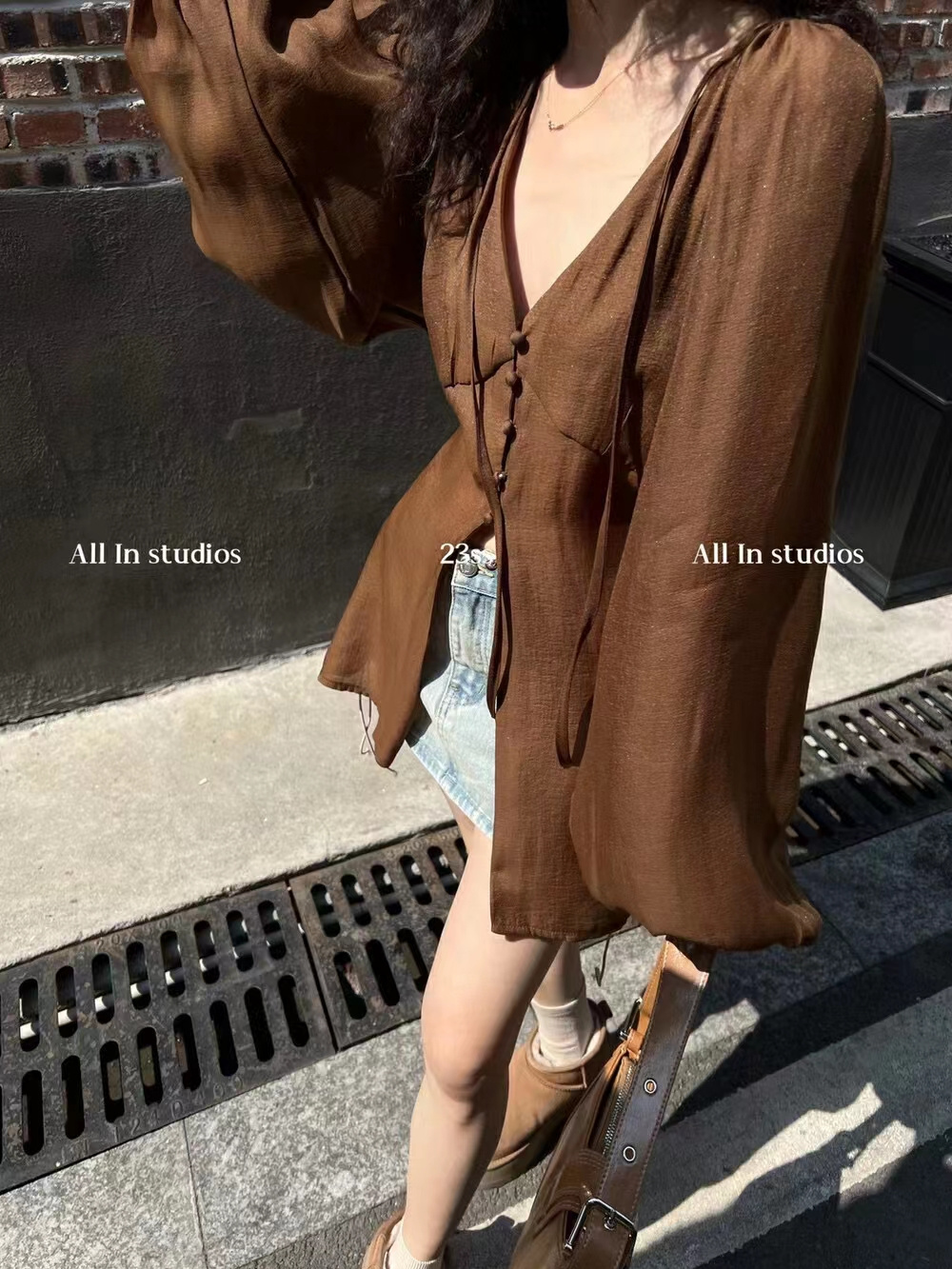 2023 spring and summer new Korean style design puff sleeves strappy breasted V-neck slit high-end temperament shirt women