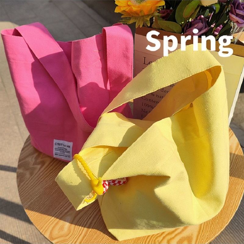 Spring and summer new butterscotch color one-shoulder canvas bag with a large-capacity hand bag mommy bag bento bag trendy
