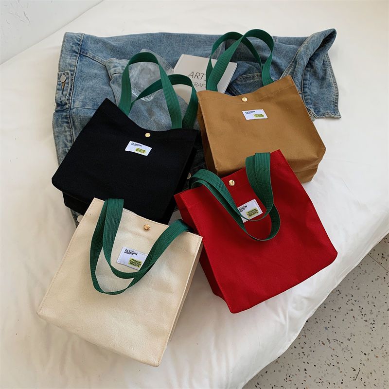 Simple ins canvas handbag female 2022 spring and summer Korean version large-capacity work small satchel casual hand cloth bag