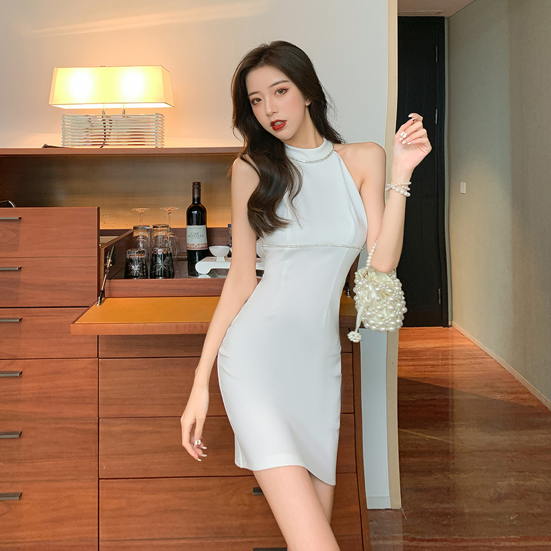 Actual shot of a temperamental little woman's halter-neck waist-hugging sleeveless party holiday dress