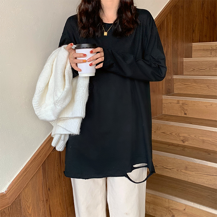 Real shot of early spring simple hand-made one-piece worn-out ripped long-sleeved T-shirt