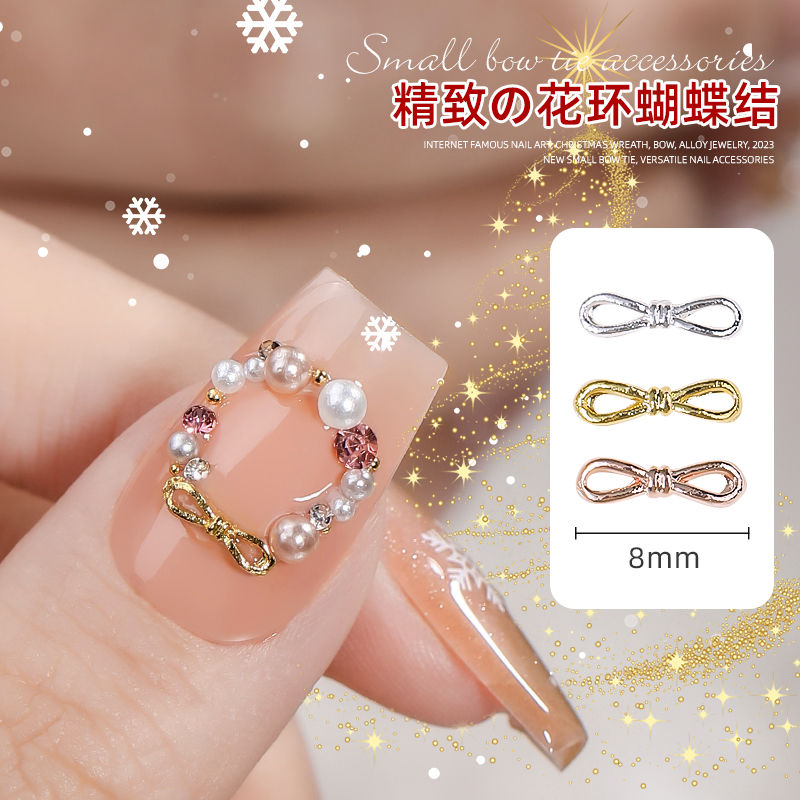 Internet celebrity manicure Christmas wreath butterfly combined with gold jewelry 2023 new small bow tie versatile nail accessories snowflake