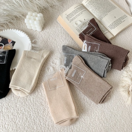 Autumn and winter new milk coffee color cashmere basic pile socks double needle solid color vertical strip women's mid-tube socks wholesale for women