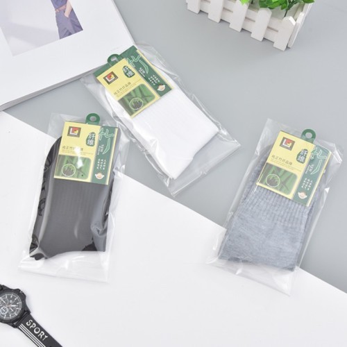 Single pair of individually packaged men's solid color casual polyester foot bath socks cheap mid-calf men's socks wholesale