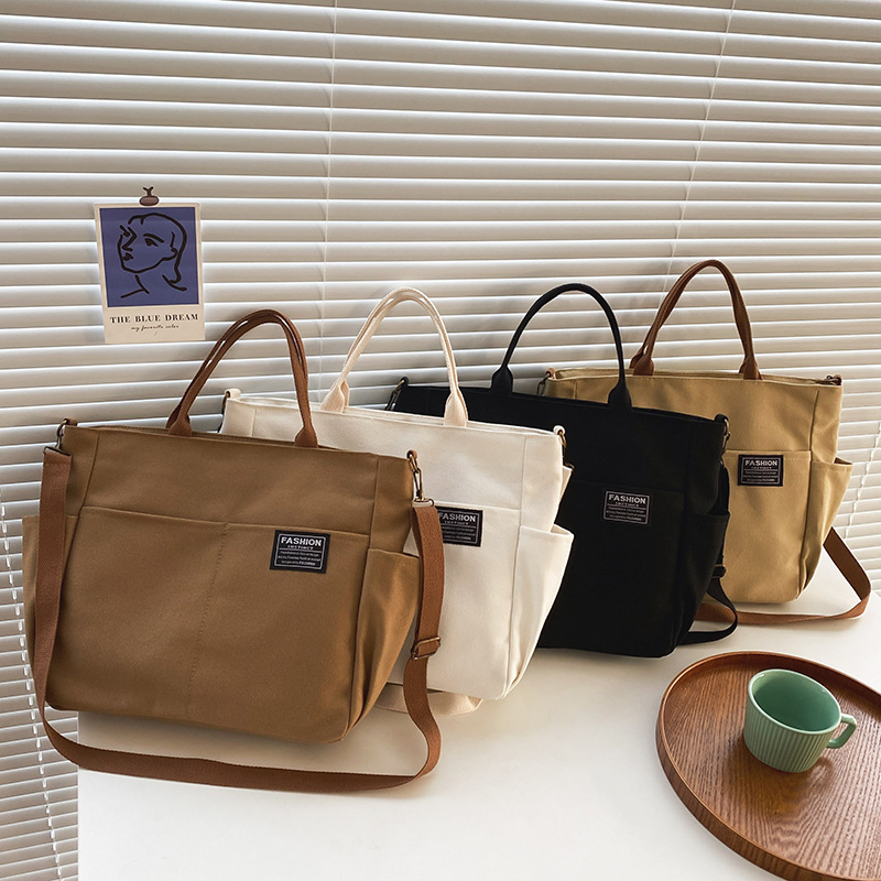 Korean ins casual retro versatile multi-pocket large capacity women's trendy canvas hand-held crossbody bag Japanese shoulder bag