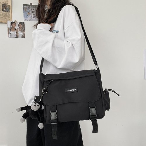 Hong Kong fashion brand couple shoulder backpack new Korean version simple male and female student crossbody bag tooling tutorial bag