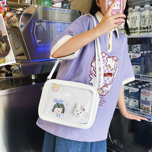 Japanese ins animation peripheral cute personality versatile street shooting soft girl student pain bag transparent girl doll bag