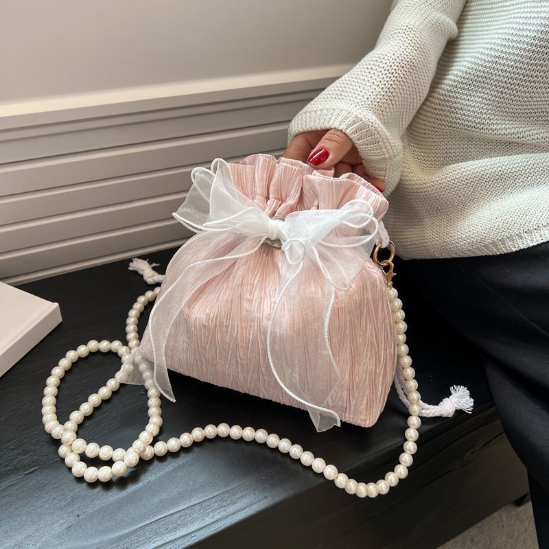 Niche fashion high-end bow crossbody bag autumn and winter new style simple and versatile one-shoulder bucket bag pearl small bag