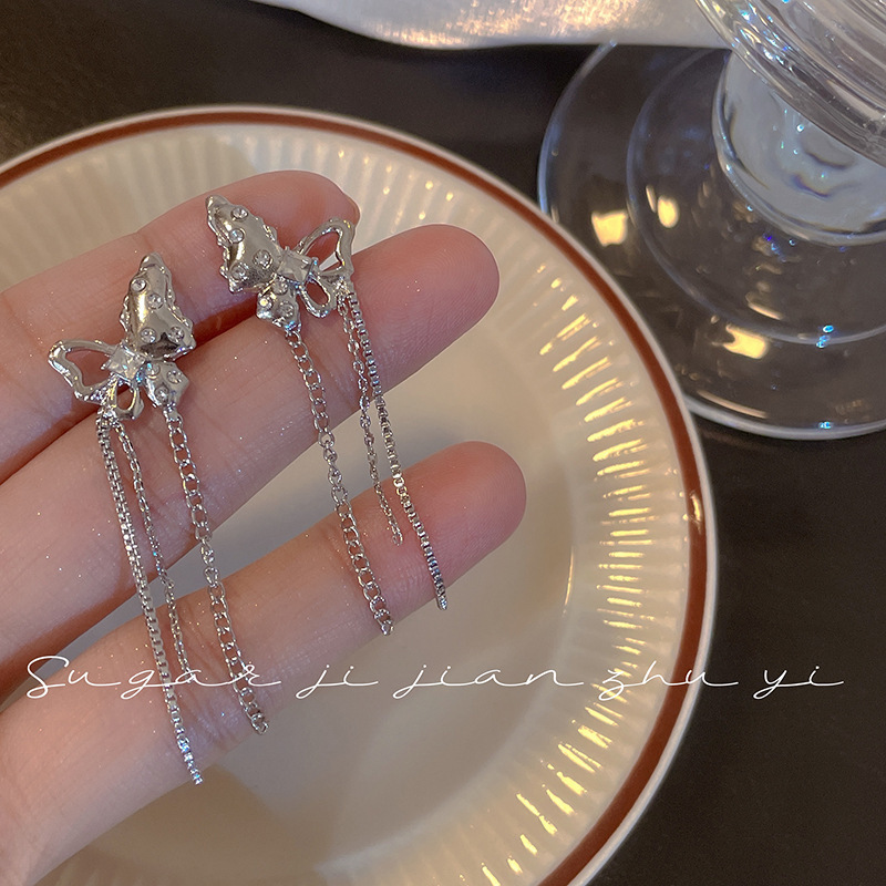S925 silver needle Japanese and Korean sweet and cool butterfly tassel earrings for women this year's new unique simple cold style hot girl earrings