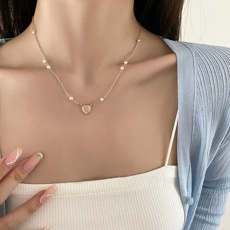 Cross-border cold style cat's eye stone love necklace for women, light luxury niche design, natural small pearl cross chain chain new