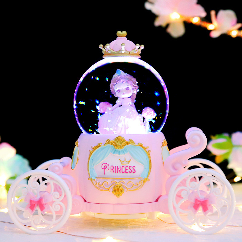 Cartoon princess drives into carriage crystal ball music box with falling snow music lanterns water polo girls and children holiday gift